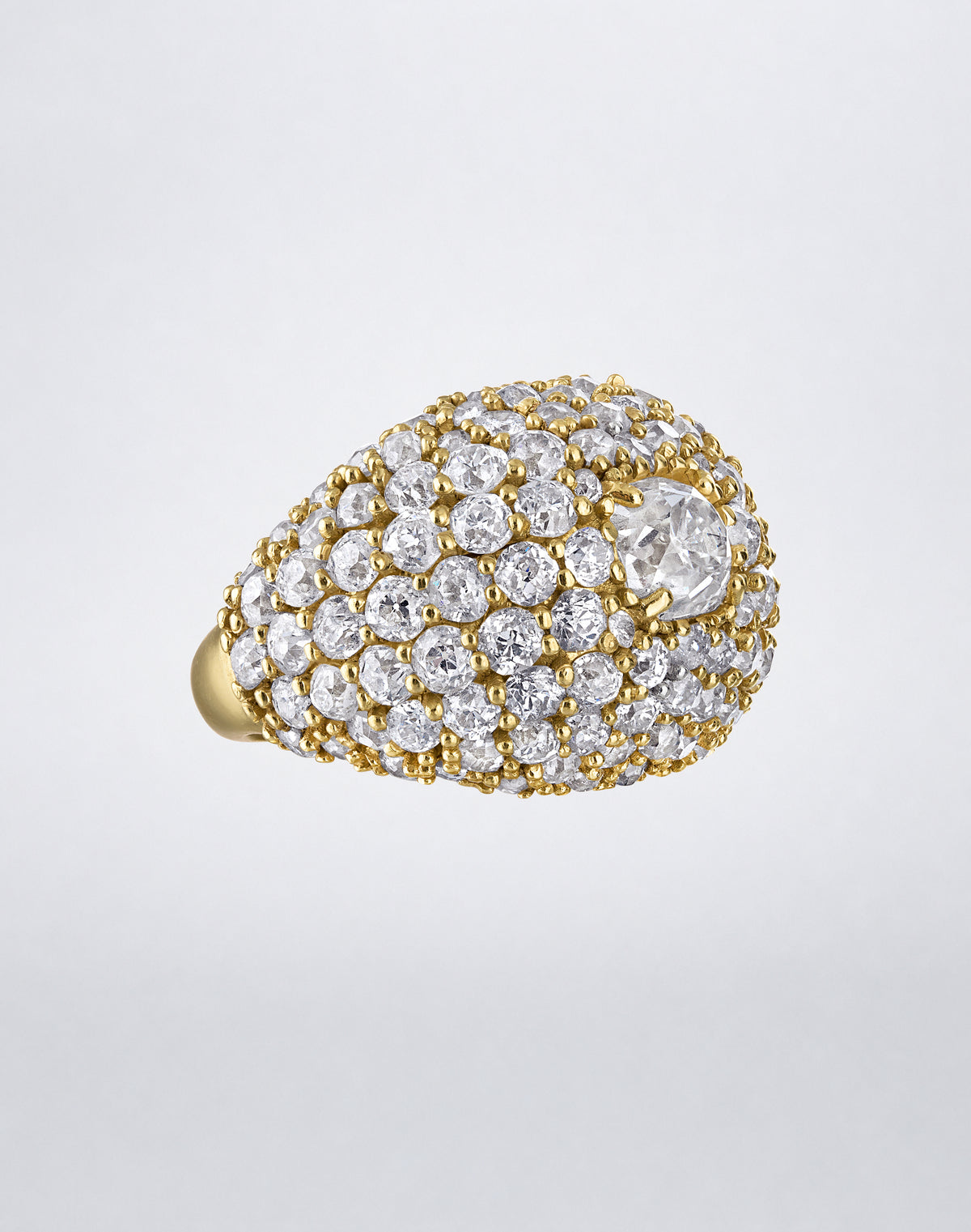 Angled view of the one-of-a-kind Old Cut Iconic Dome Ring showing the sculptural yellow gold dome covered in old-cut diamonds.