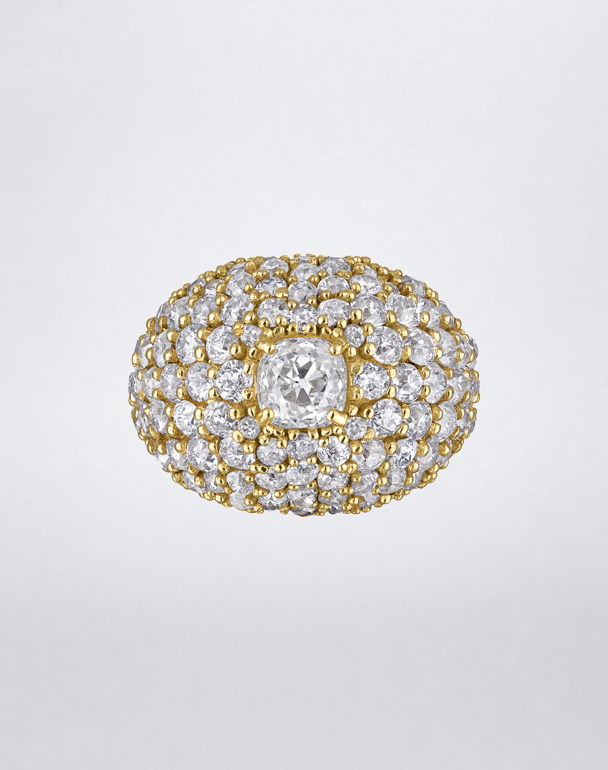 One-of-a-kind Old Cut Iconic Dome Ring featuring a domed yellow gold design densely set with old-cut diamonds and a larger central diamond.