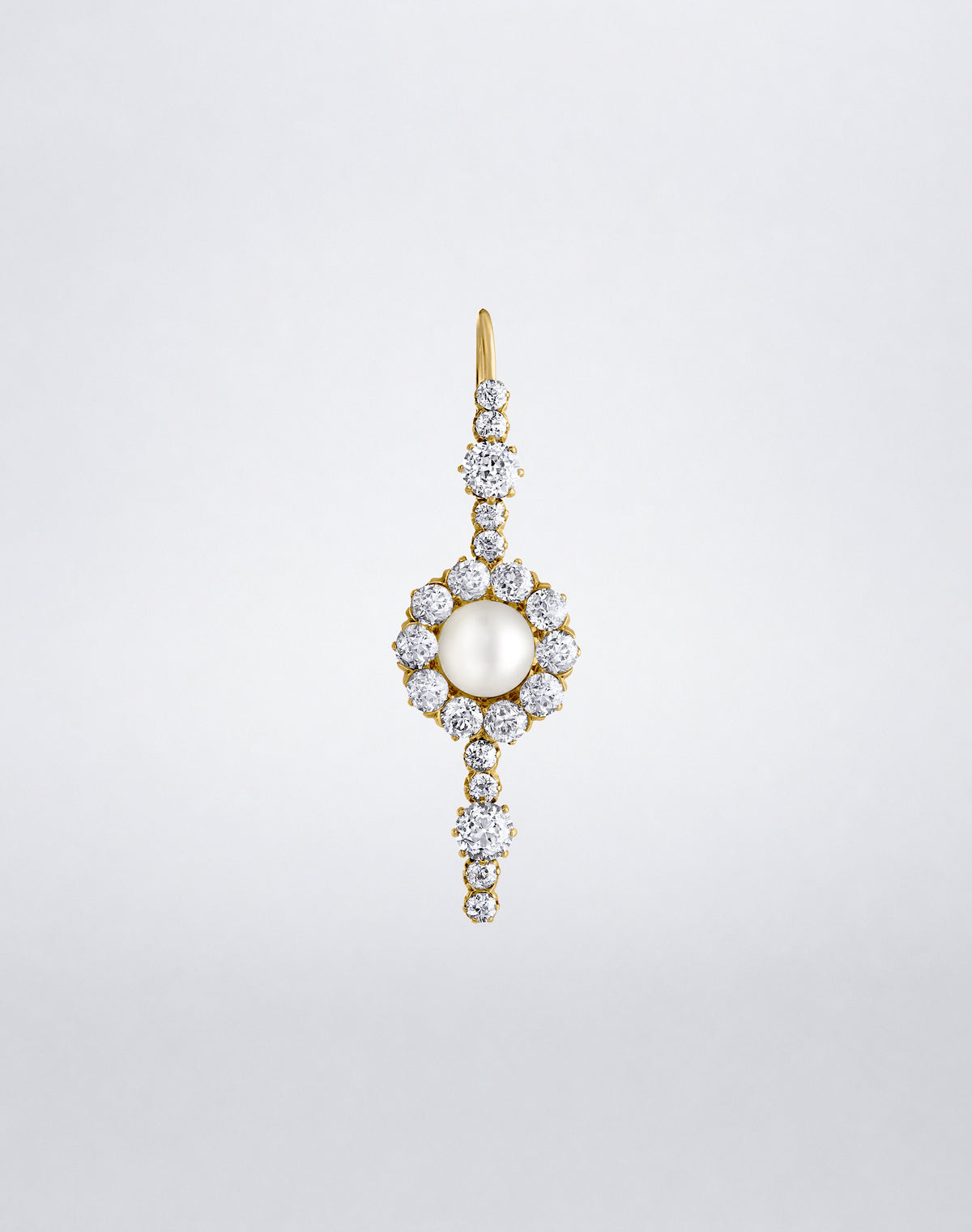 One-of-a-kind Pearl and Diamond Single Drop Earring featuring a luminous pearl framed by round diamonds with graduated diamond accents in yellow gold.